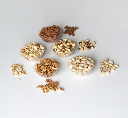Healthy food. Nuts mix assortment on stone table top view. Collection of different legumes for background image close up nuts, pistachios, almond, cashew nuts, peanut, walnut. image
