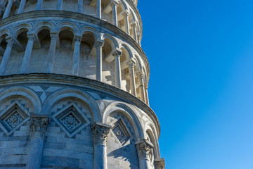 Fototapeta na wymiar The leaning tower of pisa at Piazza del Miracoli Duomo square,Camposanto cemetery in Tuscany, Italy