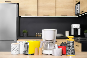 Fototapeta na wymiar Set with modern domestic appliances in kitchen