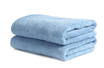 Fototapeta na wymiar Folded clean soft towels on white background