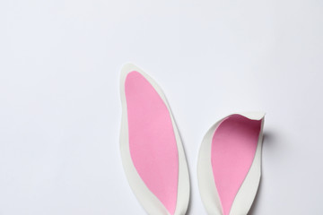 Funny Easter bunny ears on white background, top view