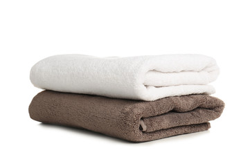 Folded soft terry towels on white background