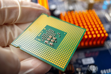 Chip microprocessor in the hands of an engineer technician for the computers. High technology and...