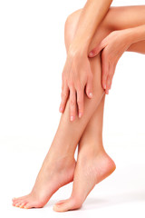 Beautiful long female legs, unwanted hair removal concept. Skin care. White background