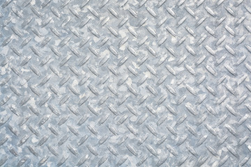 Checkered metal plate covered with zinc. Grundy metal texture background