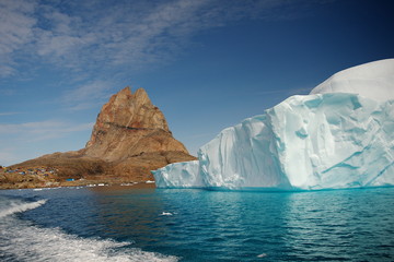 Obraz na płótnie Canvas Iceberg, mountains, water, sky.