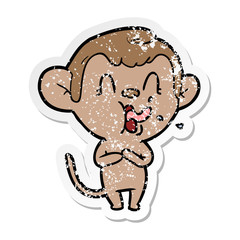 distressed sticker of a crazy cartoon monkey