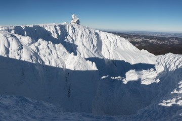 Snow Structure with sunshine in the Background, Panorama of Snow Holes With Wawel Transmitter - Krkonose (Giant Mountains), Czech Republic, Europe Sun shines over the winter czech mountains ski resort