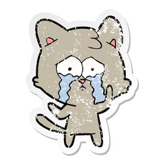 distressed sticker of a cartoon crying cat