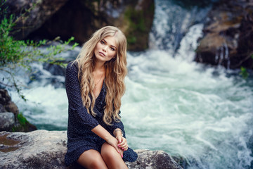 Happy pretty girl in field at sunset. Art photo