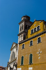Fototapeta na wymiar Italy, Venice, a clock on the side of a building
