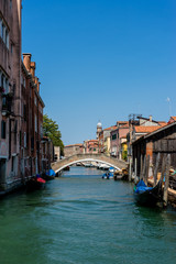 Fototapeta na wymiar Italy, Venice, Gondola, being serviced repaired