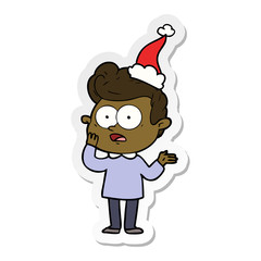 sticker cartoon of a staring man wearing santa hat