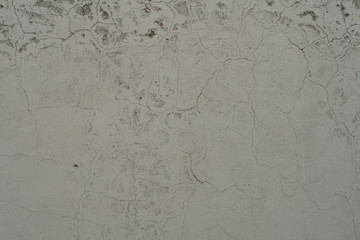  Close up of a concrete wall with moisture and breaks