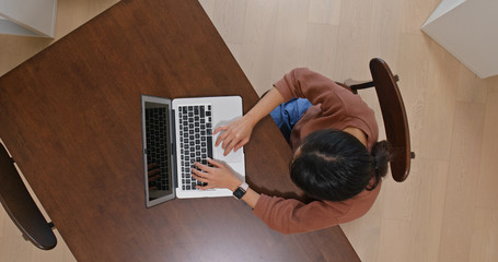 Woman use of computer from top