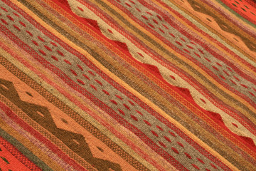  close-up of a wool rug dyed with natural pigments and handmade, typical craftsmanship of the city of Oaxaca in Mexico
