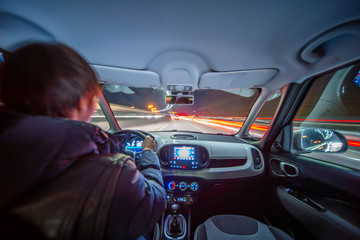 Night city road view from inside car