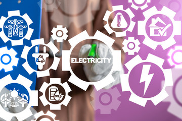 Electrician uses on a virtual screen of the future and touches the word: electricity. High-voltage power lines. Electricity distribution system concept. High voltage electric transmission industry.