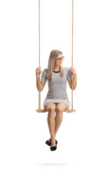 Young cheerful woman sitting on a swing