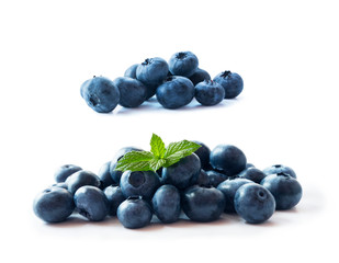 Heap of blueberry fruits isolated on white background. Ripe blueberries with copy space for text. Blueberry isolated on white. Bilberries  on a white background. Top view.  Blue food.