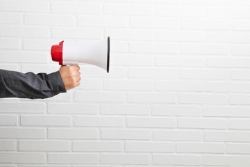 hand with isolated megaphone on white background