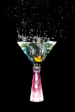 Martini Glass with Olive Splashing