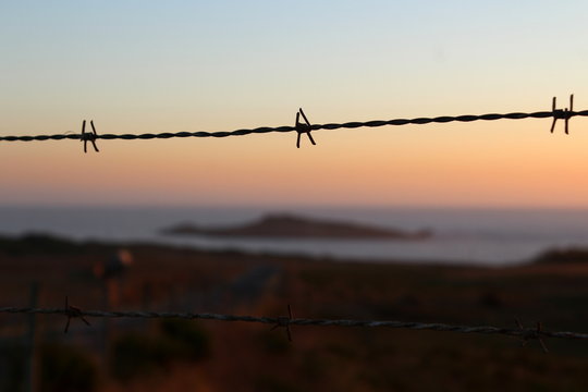 Island behind barbed wire, Pessegueiro, Porto Covo, Portugal