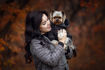 Cute young girl with yorkshire terrier dog