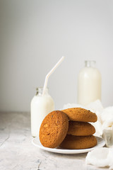 Healthy Breakfast with Oatmeal Cookies and Milk on a light background. Concept Healthy Eating