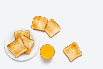 Toast and orange juice on a white background.