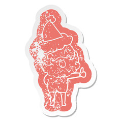 man with beard sticking out tongue wearing santa hat