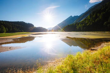 A look at the pond Obersee in the sunlight. Scenic wealth of Swiss alps.