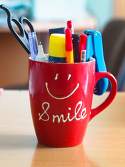 cup smile  with office supplies