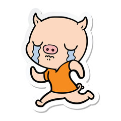 sticker of a cartoon pig crying running away