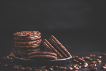Chocolate chips cookies on black background. Matte toned