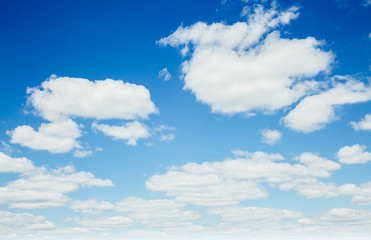 Fantastic view of the azure sky on a sunny day with fluffy clouds.