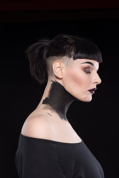 High Fashion Model Girl Portrait with Trendy gothic Black make-up.