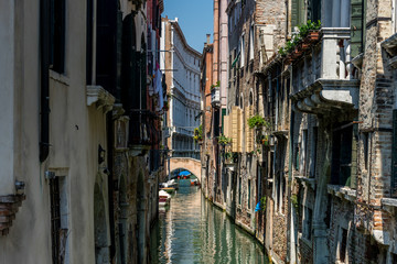 Fototapeta na wymiar The narrow canal of Venice, Italy