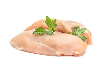 Raw chicken fillet with parsley on white.