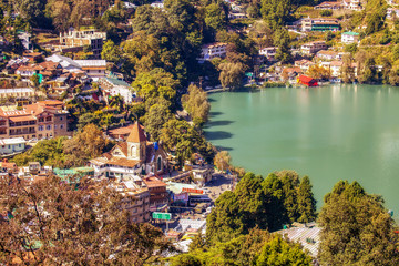 Fototapeta na wymiar Aerial view of Nainital cityscape with famous Nainital lake considered as a scenic hill station and tourist destination at Uttarakhand India