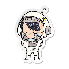 distressed sticker of a cartoon crying astronaut girl