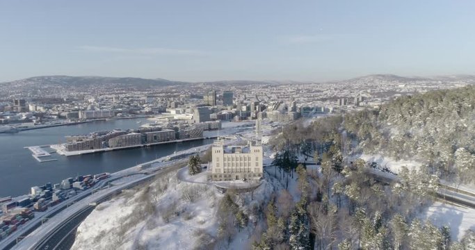 4K high angle aerial view of the beautiful Oslo skyline, The Munch Museum called Lambda and Barcode, a part of the new Bj&oslash;rvika Opera quarter in Oslo, in vibrant winter sunlight.