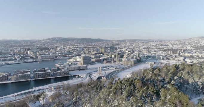 4K high angle aerial view of the beautiful Oslo skyline, The Munch Museum called Lambda and Barcode, a part of the new Bj&oslash;rvika Opera quarter in Oslo, in vibrant winter sunlight.