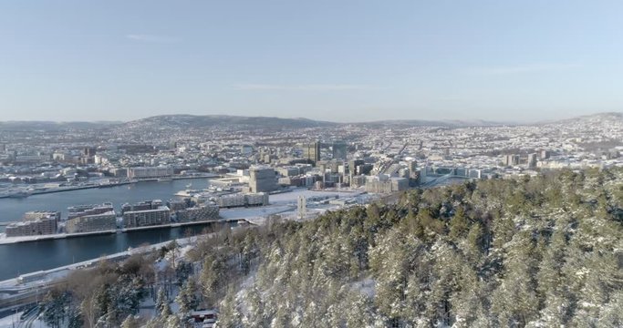 4K high angle aerial view of the beautiful Oslo skyline, The Munch Museum called Lambda and Barcode, a part of the new Bj&oslash;rvika Opera quarter in Oslo, in vibrant winter sunlight.
