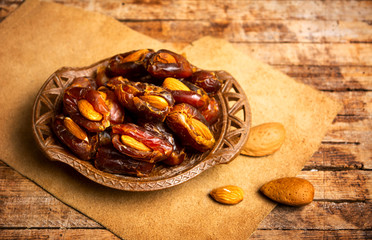Fresh dates with almonds on a table
