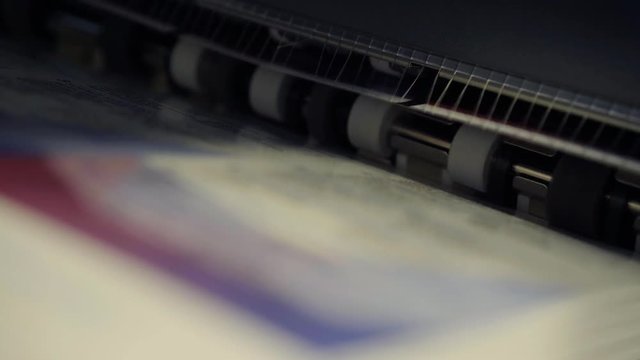 Paper printer spitting out material.