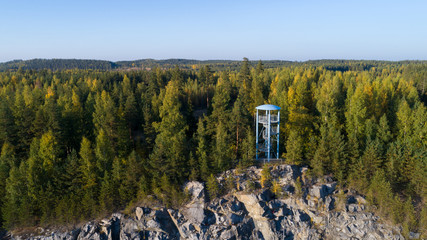 Watch tower on the rock. Beautiful summer day and blue sky.