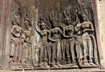 Bas-relief in the form of Apsara dancers stone carving on the wall  of Angkor Wat temple, Siem Reap, Cambodia