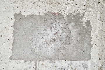 A square patch of concrete with old grunge effect. Place for text.