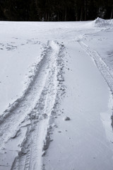 Tracks in the snow. Dangerous road.